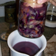 Kraut Jar Weighing down Kraut in Larger Vessel