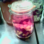Beet kvass early in the process, as color and sugars from the beets begin to infuse the solution.